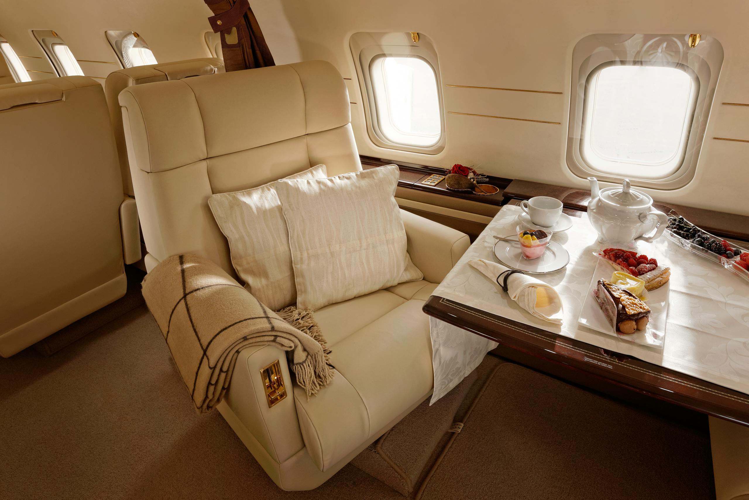 Elegant aircraft interior with beautiful desserts served
